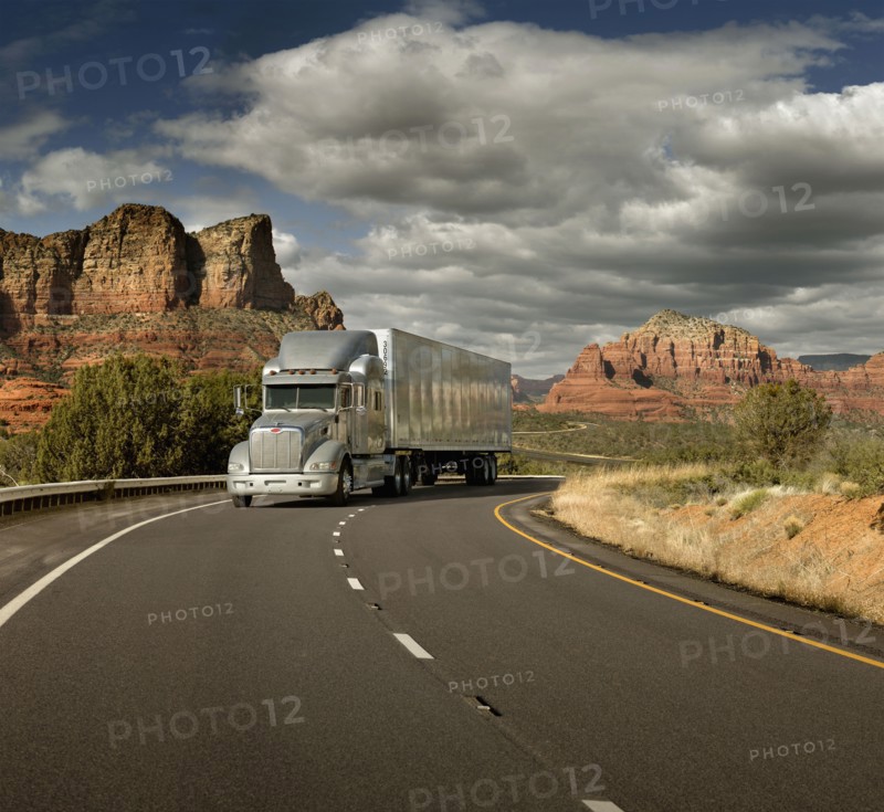Semi truck driving through desert