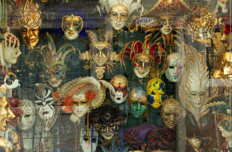 Decorative masks hanging in store window