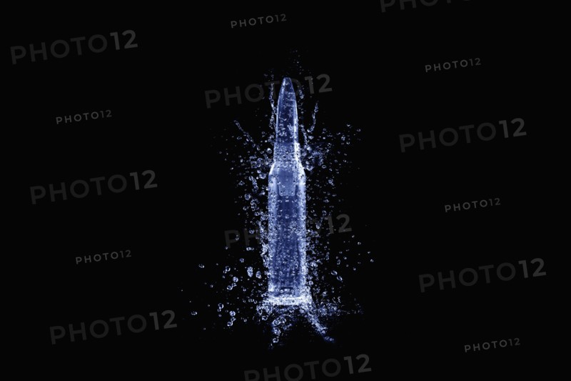 Close up of bullet casing shattering
