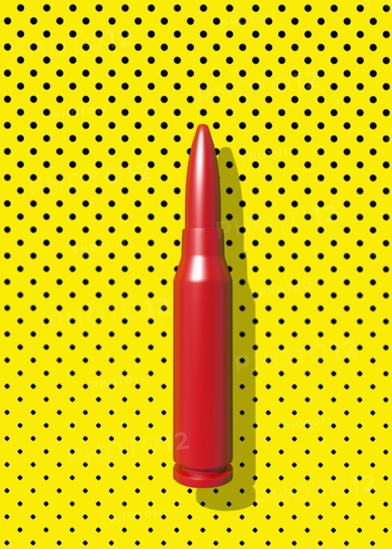 Close up of red bullet casing on polka dot background