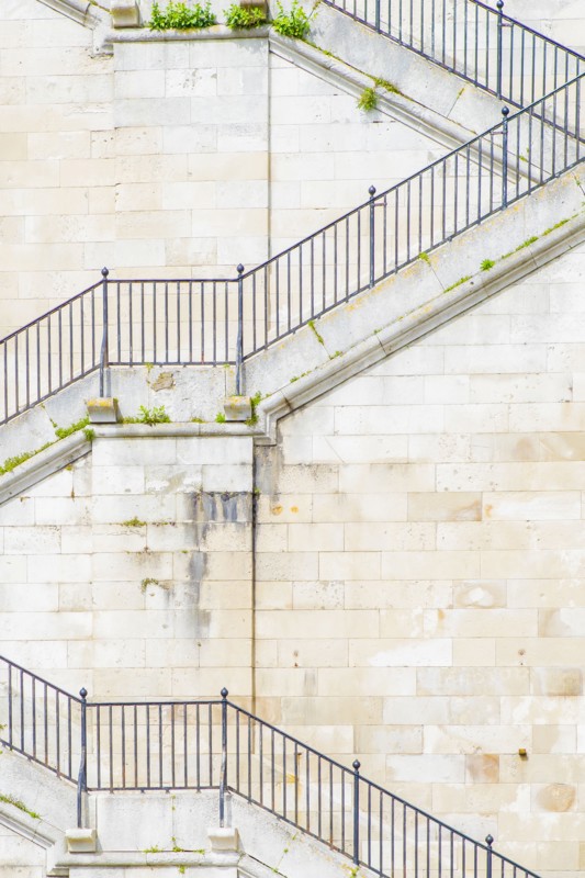 Banister and staircase on tall building