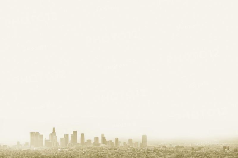 Silhouette of city skyline in hazy sky