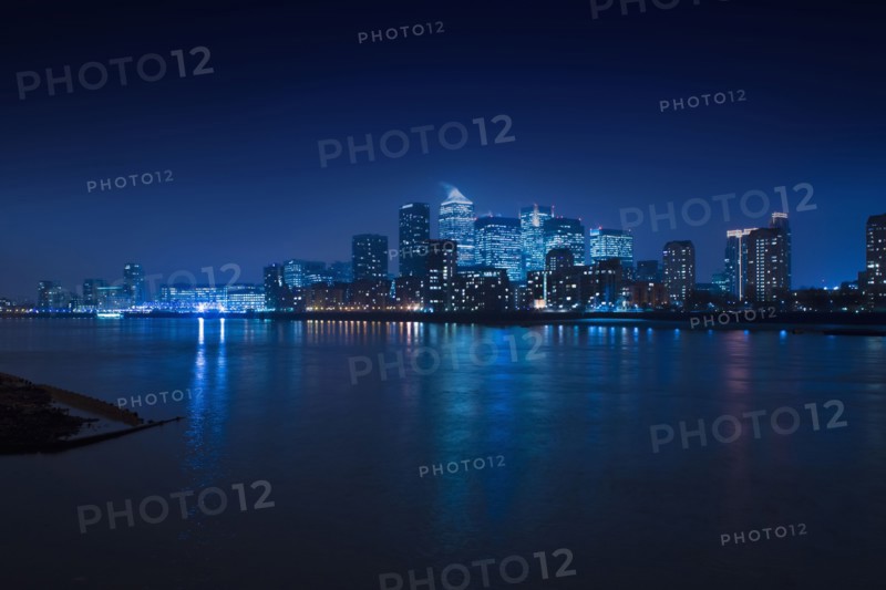 Illuminated skyline in cityscape at night