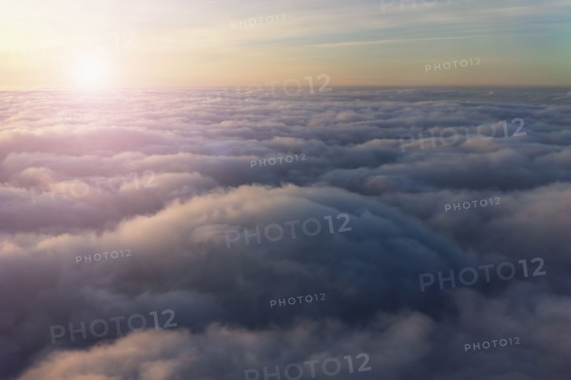 High angle view of sky above clouds