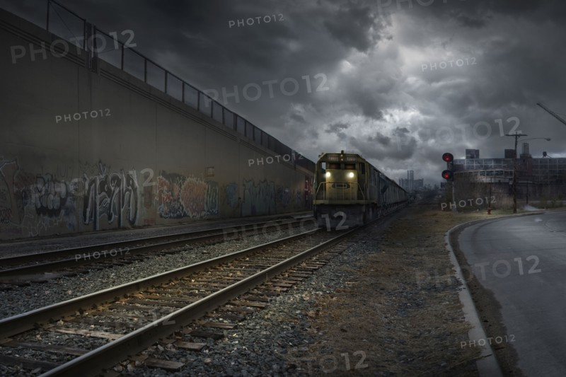 Train on train tracks in dilapidated industrial city