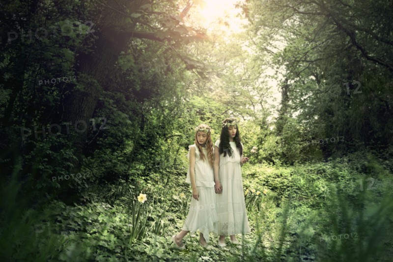 Caucasian girls exploring garden