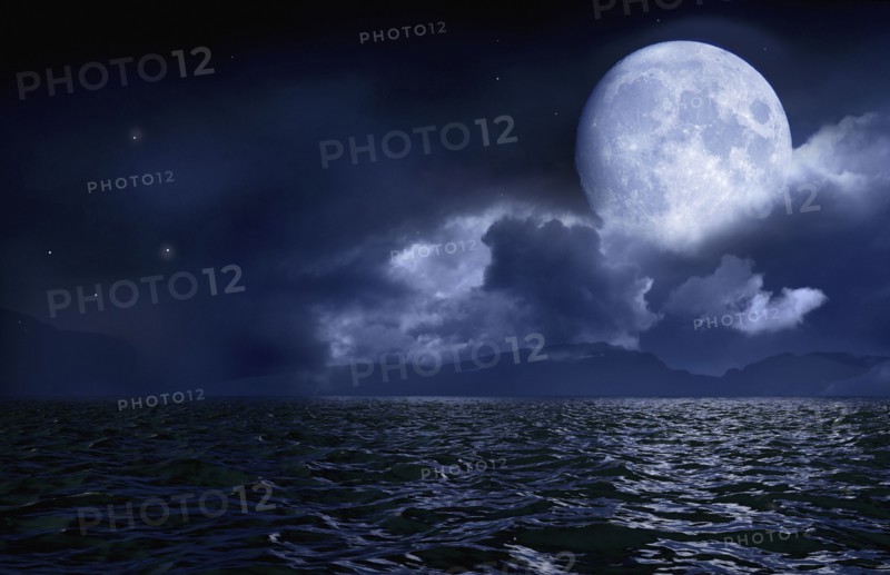 Full moon over seascape and horizon