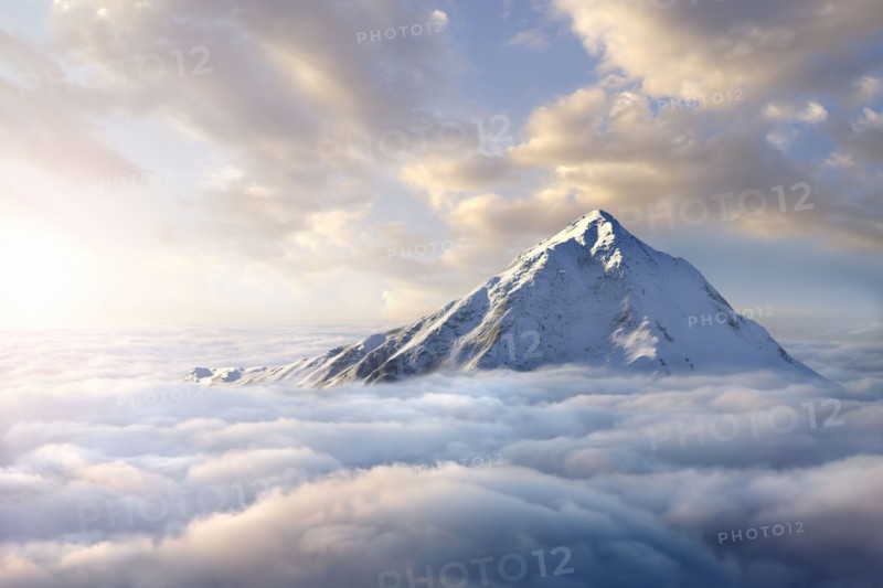 Snow-covered mountaintop above clouds