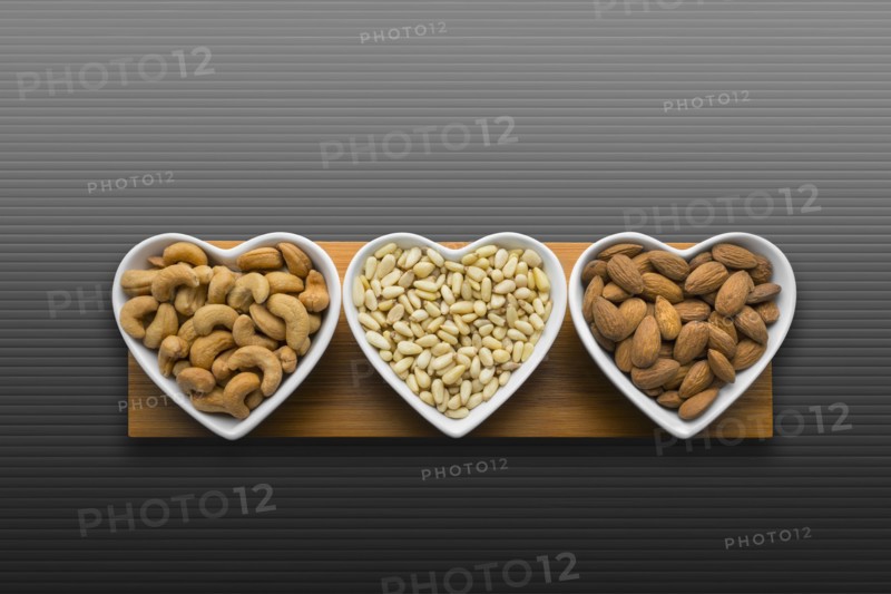 Heart-shaped bowls of heart-healthy nuts