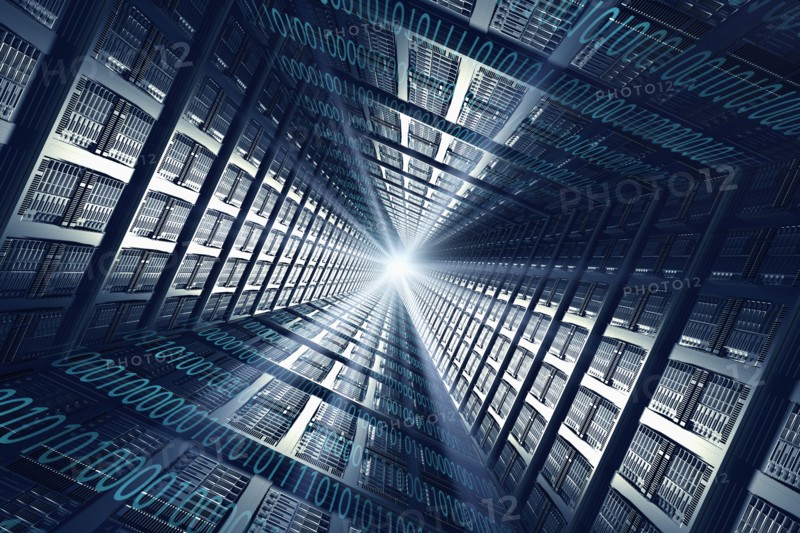 Light shining from binary code and computer servers
