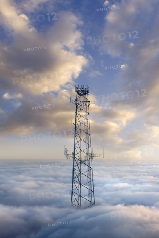 Cellular tower above clouds