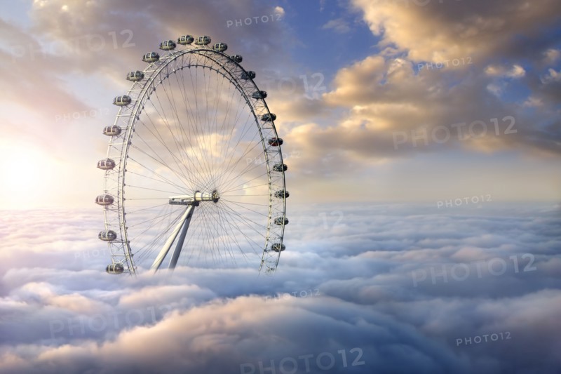 Ferris wheel above clouds