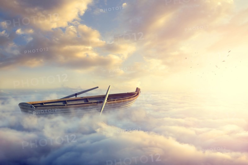 Empty rowboat above clouds