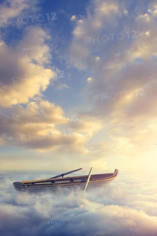 Empty rowboat above clouds