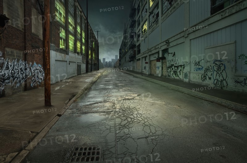 Graffiti on walls on empty city street