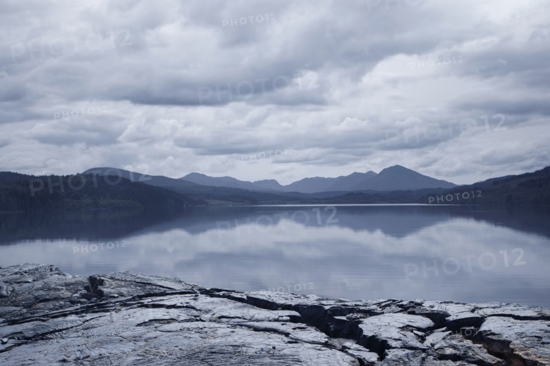 Reflection of clouds in mountain lake