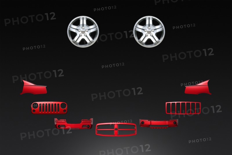 Car parts forming smiley face on black background