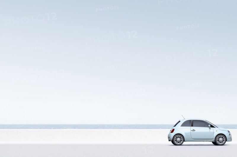 Blue car near ocean