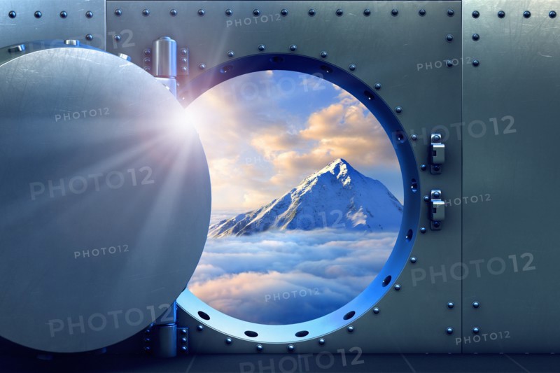 Open vault door revealing mountaintop above clouds