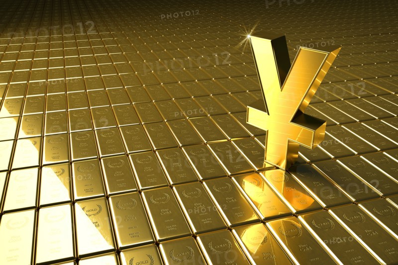 High angle view of gold bars and yuan symbol