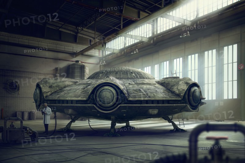 Scientist researching spaceship in hangar