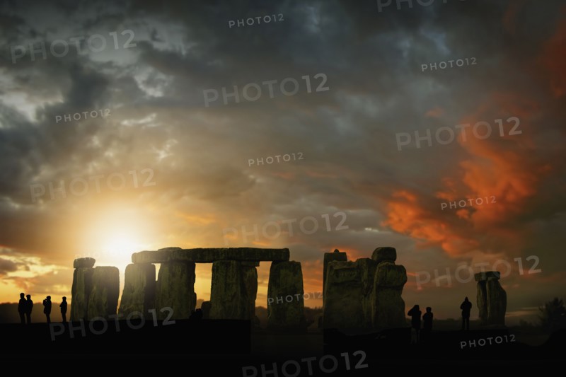 Silhouette of people during sunset at Stonehenge