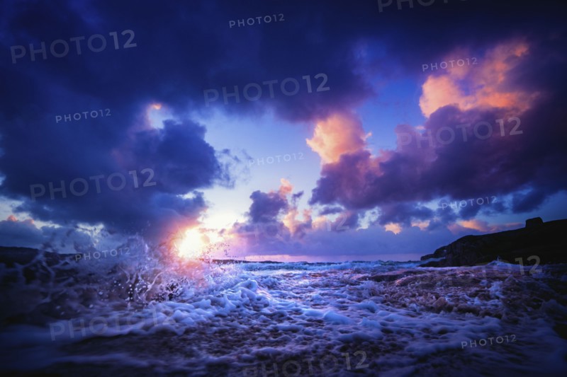 Waves splashing at sunset