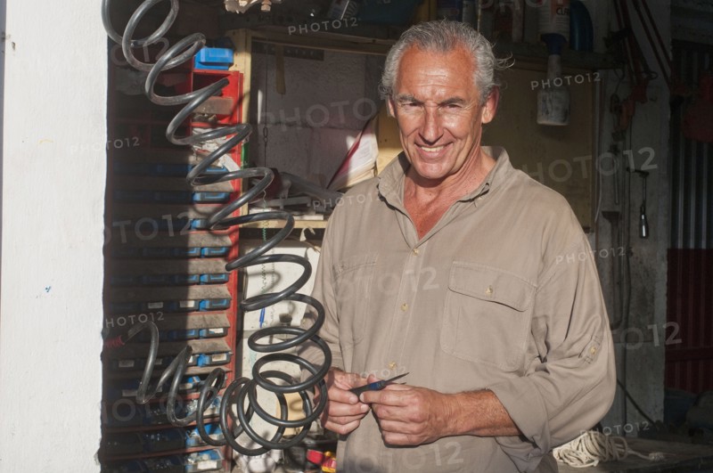 Hispanic mechanic in workshop