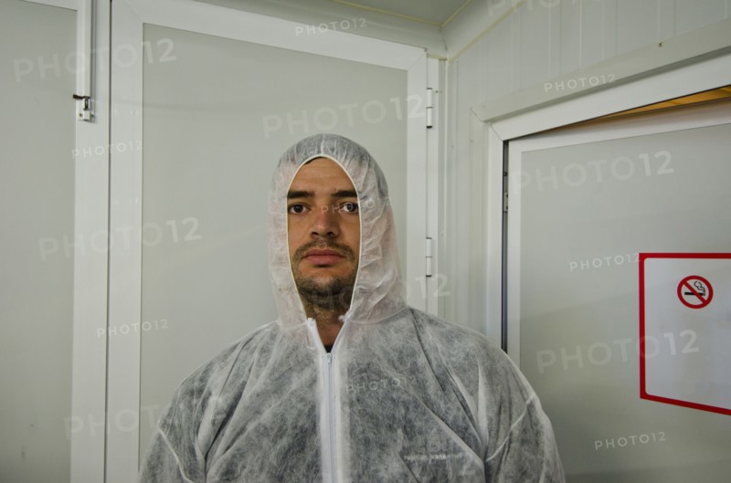 man in safety coverall in food processing plant