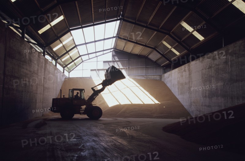 Front-end loader in grain warehouse