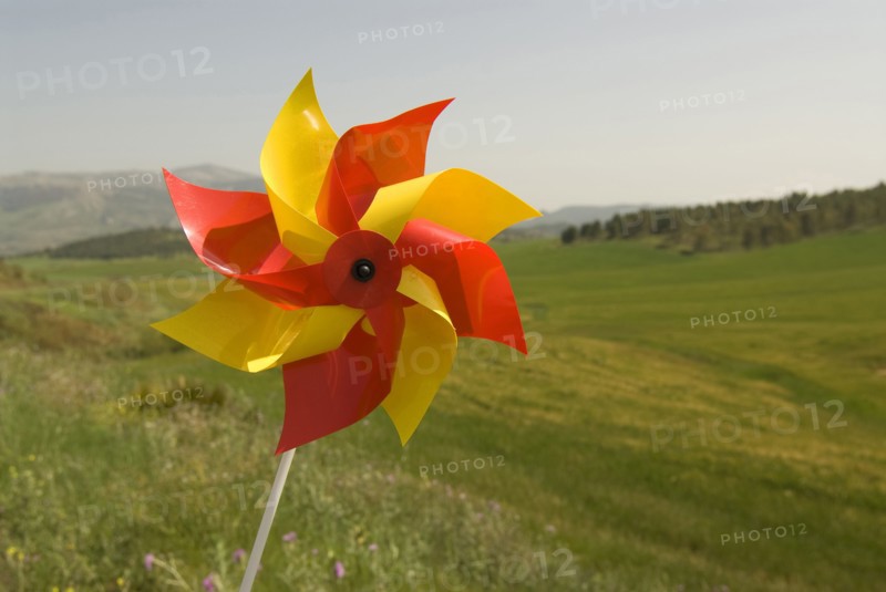 wind wheel over green fields