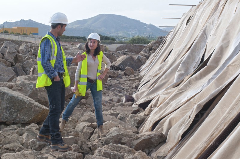 male and female engineers in construction site
