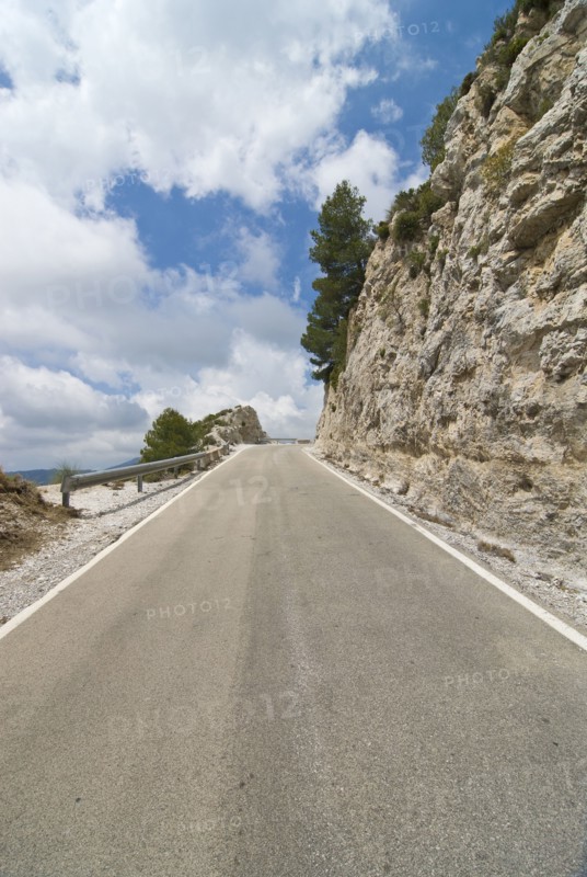 Mountain road running to vanishing point