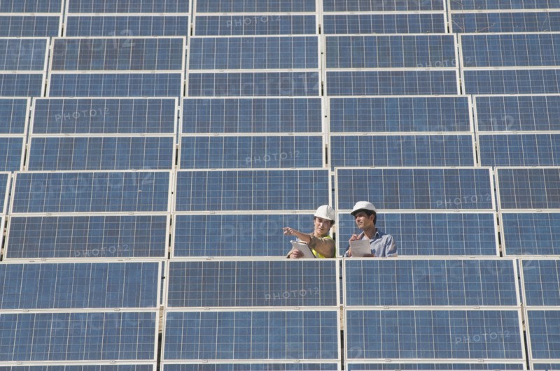 two engineers in solar power plant