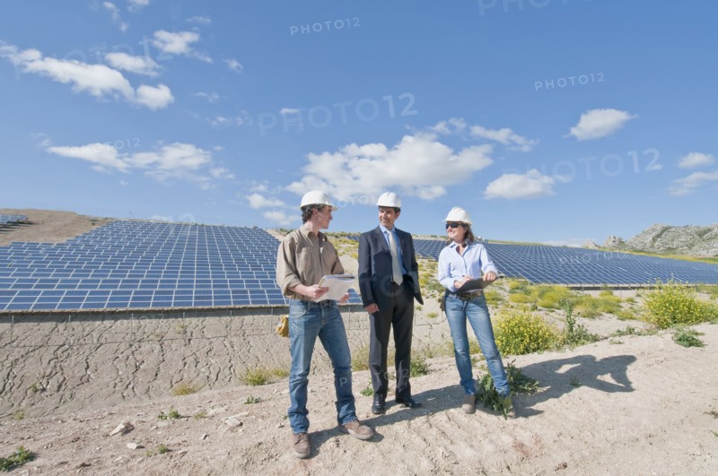 engineers and businessman in solar plant