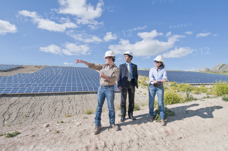 engineers and businessman in solar plant
