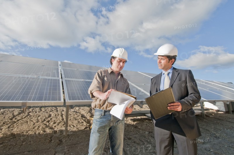 engineer and businessman in solar plant