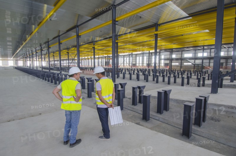 Workers talking in warehouse