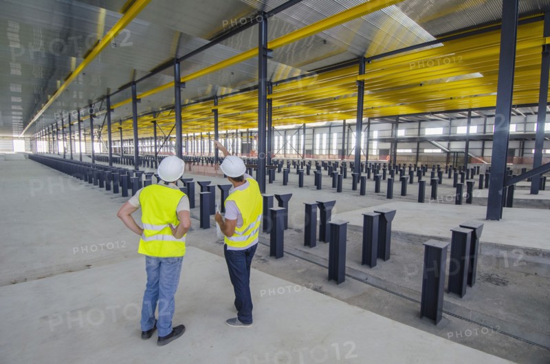 Workers examining warehouse