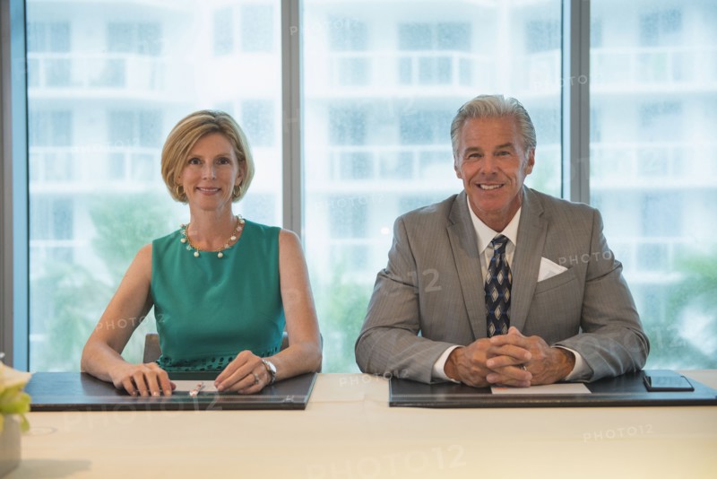 Caucasian business people smiling in meeting