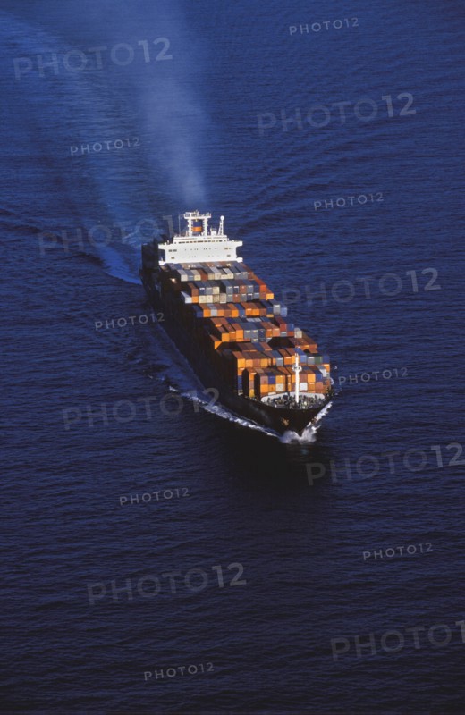 Aerial view of shipping barge sailing on ocean