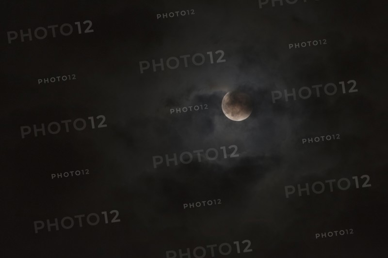 Moon glowing in night sky