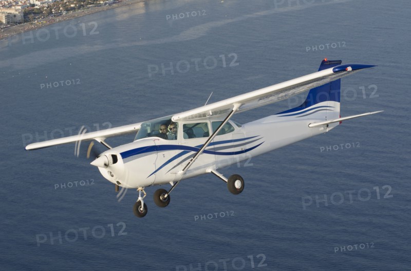 Aerial view of airplane flying over ocean