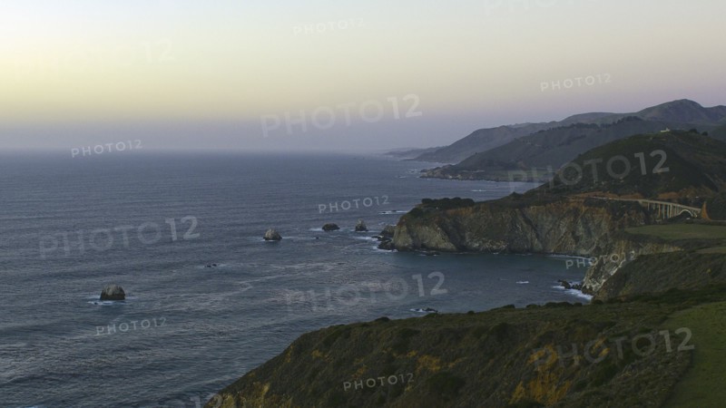 Scenic view of cliffs at ocean