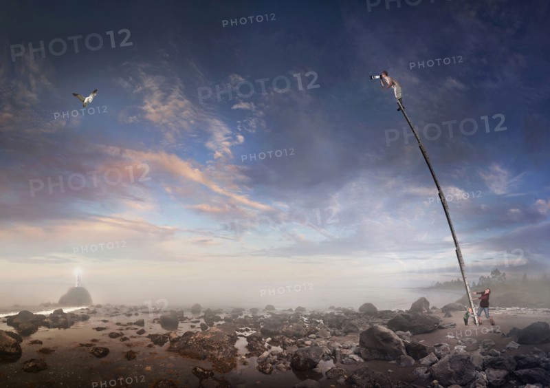 Caucasian family holding ladder for photographer