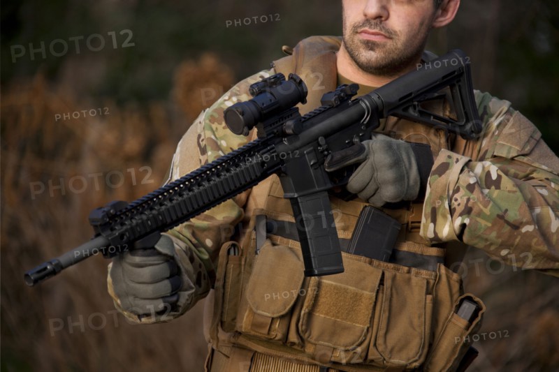 Soldier aiming automatic weapon during training