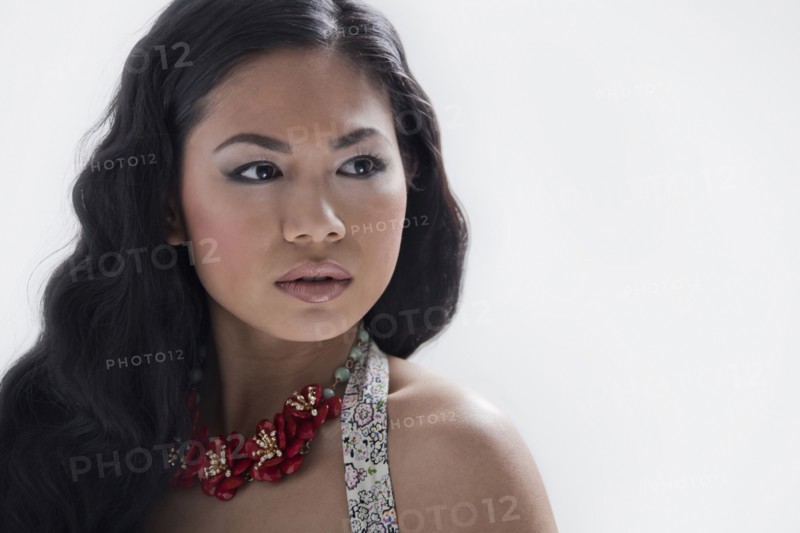 Asian woman wearing flower necklace