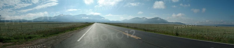 Panoramic view of empty road in rural landscape
