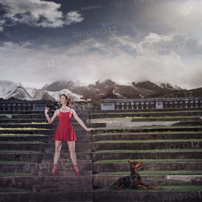Caucasian ballet dancer balancing on ruins