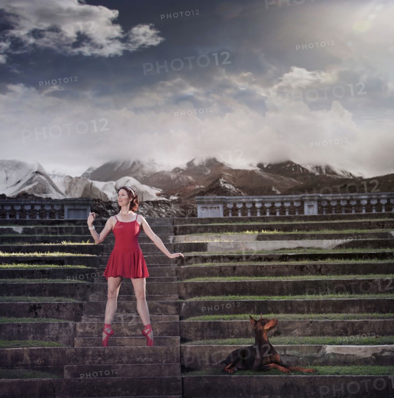 Caucasian ballet dancer balancing on ruins